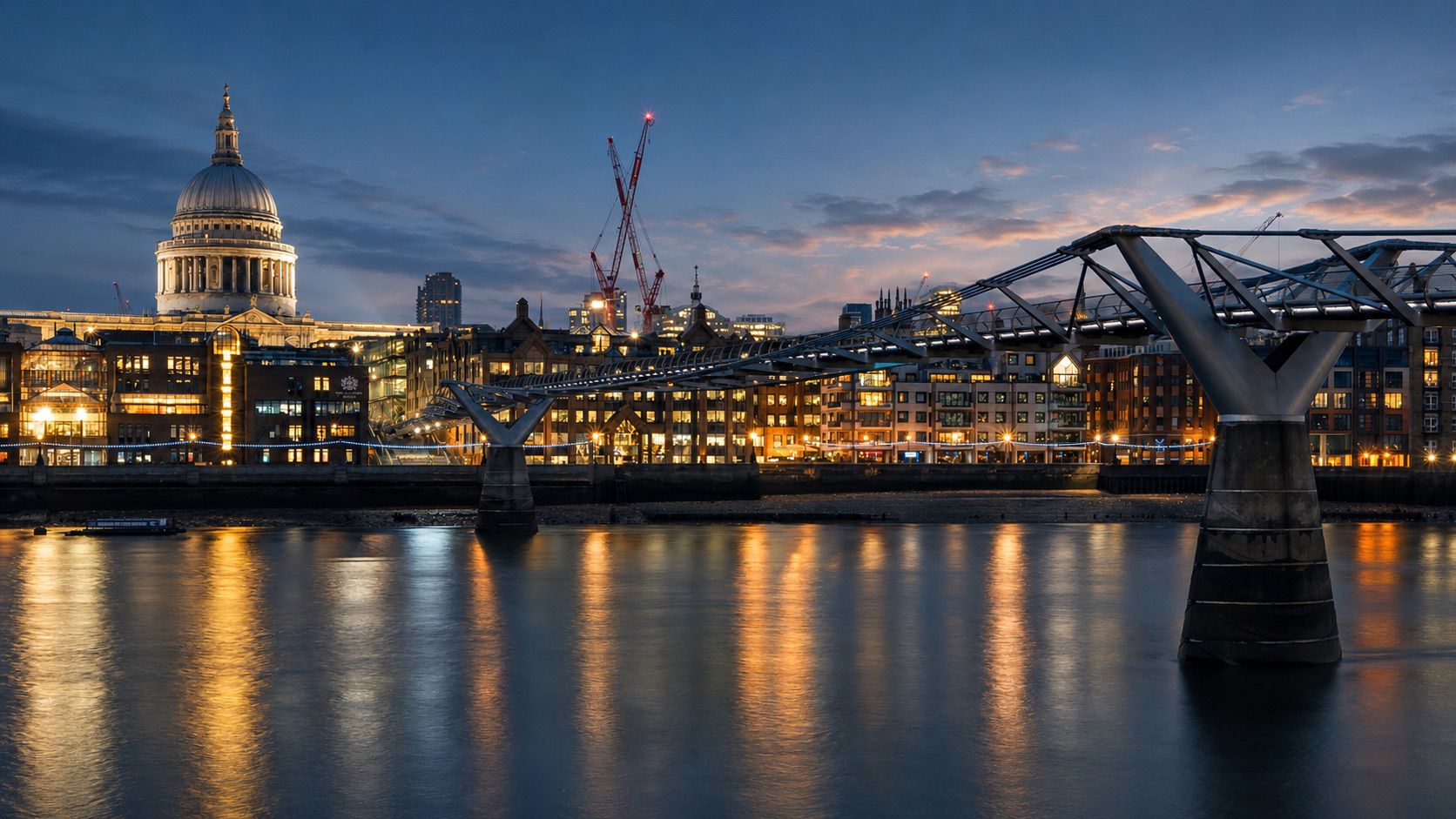 St Paul's Cathedral and the Millennium Bridge at blue-hour twilight — the London backdrop to Factr's work